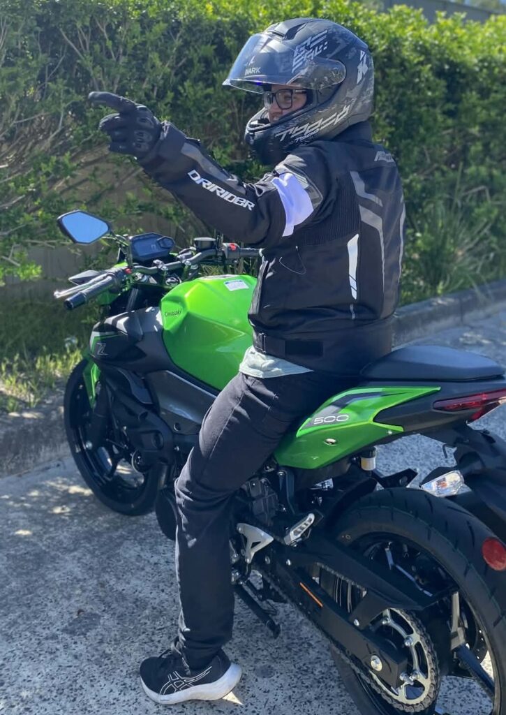 Man on motorbike with helmet